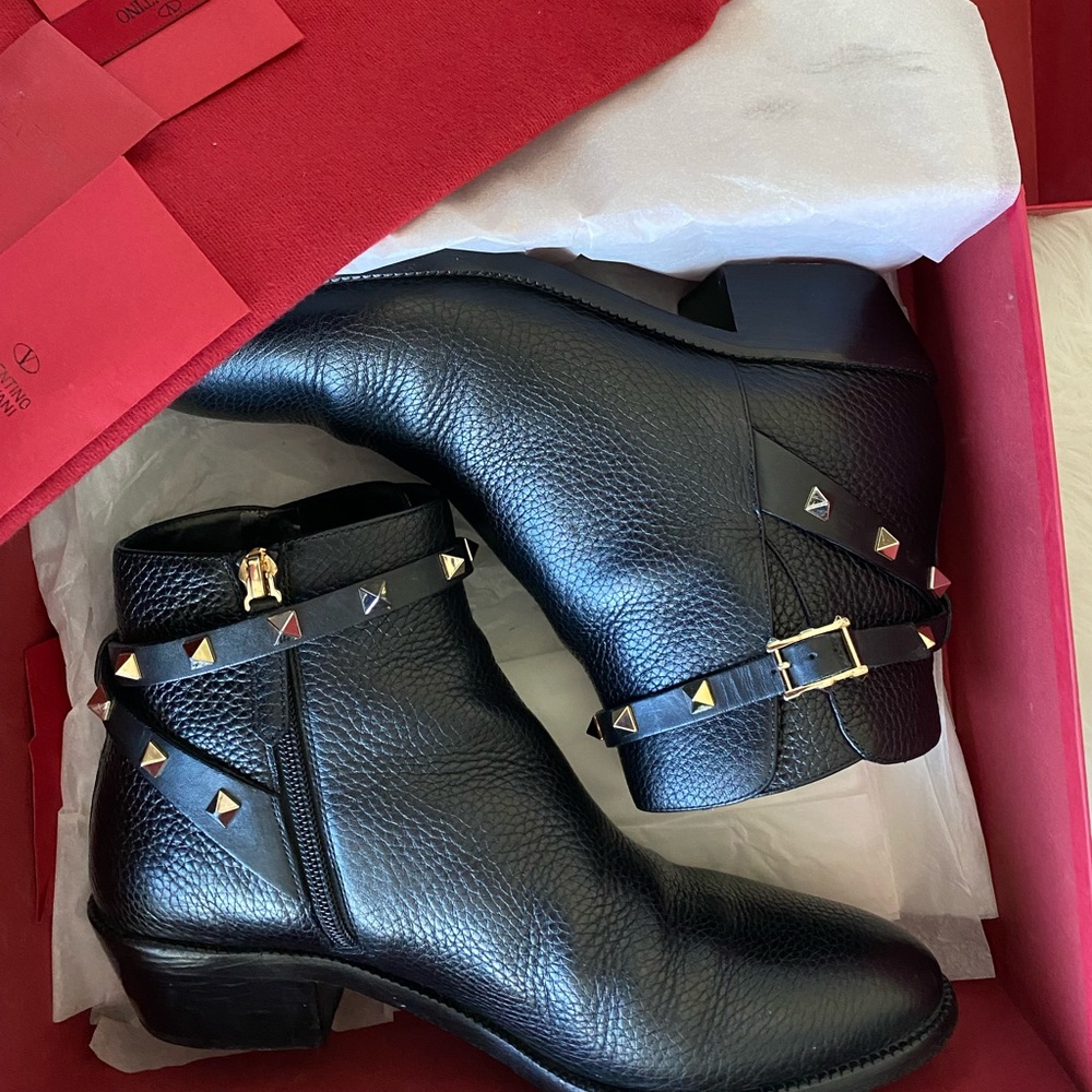 Valentino Garavani Rockstud black pebble leather ankle bootie with gold studs